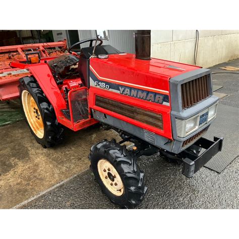 Thematic photo of a Yanmar F18D mini tractor with attached equipment