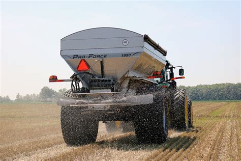Thematic photo of a large agricultural spreader working in the field