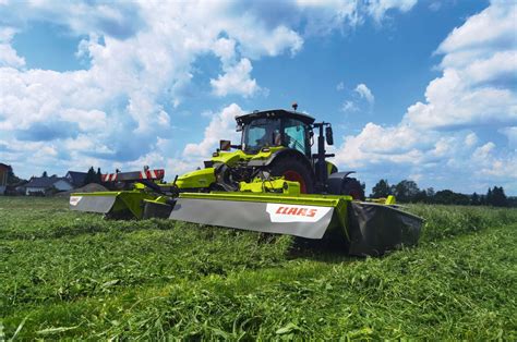 Thematic photo of CLAAS disc mowers working in a field