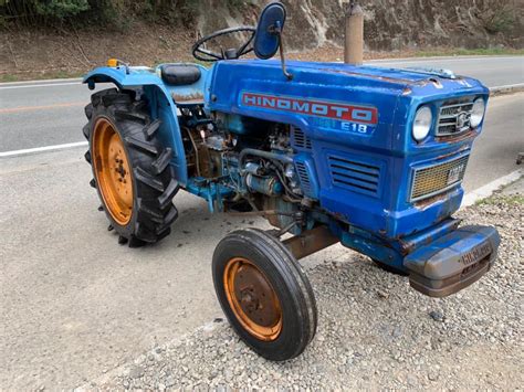 Thematic photo of a Hinomoto D14 4WD mini tractor in action