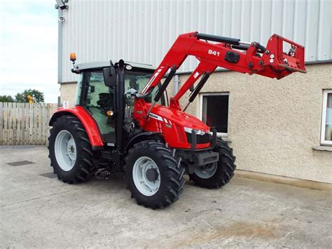 The Massey Ferguson 5612 tractor with a front loader performing various tasks, such as loading pallets or clearing snow.