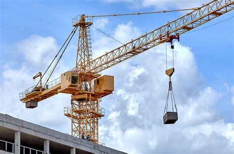 Thematic photo of a mini crane working on a construction site
