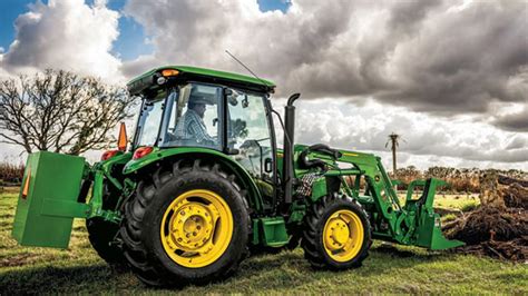 Thematic photo of a John Deere 5E series tractor working in a field