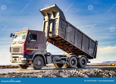 Thematic photo of a dump truck with a raised body