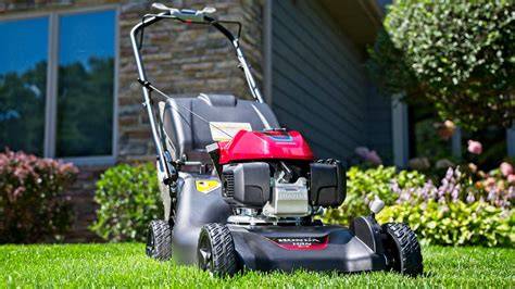 Photo of a gasoline lawnmower in action