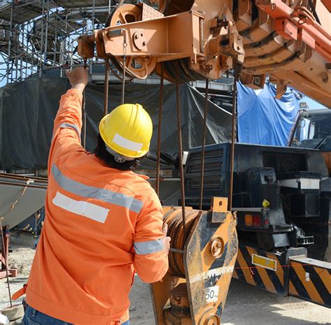 Thematic photo of a mechanic inspecting a crane