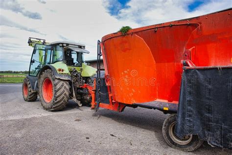 Thematic photo of a Troll loader with a tractor during farm work