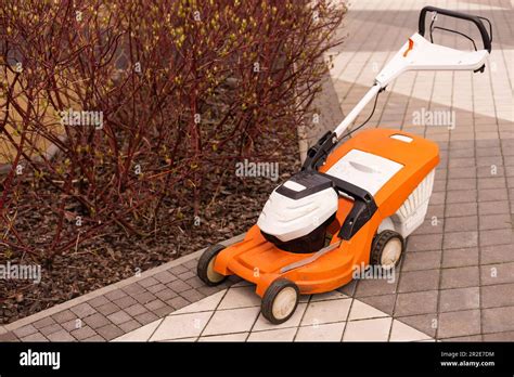 Thematic photo of a CMI lawnmower in a garden