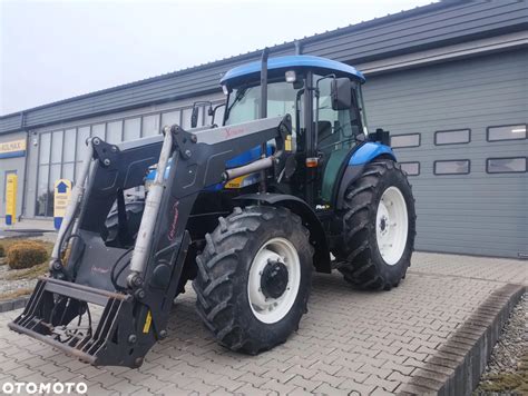 Zdjęcie ciągnika New Holland TD80D z kabiną i ładowaczem czołowym