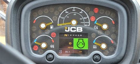 Dashboard of a JCB machine with various indicator lights