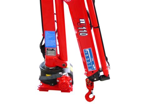 Photo of Maxilift ML 110 crane in operation, highlighting its compact size and lifting capabilities.