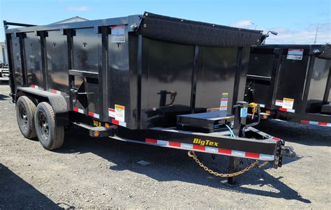 Photo of a large dump trailer with a shell body