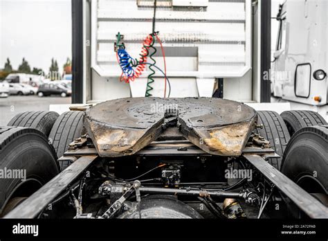 Thematic photo of a truck trailer being inspected before coupling to the tractor.