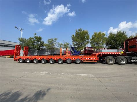 Photo of two large transformer stations being transported simultaneously on a multi-axle trailer.