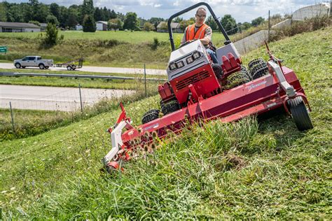 Thematic photo of a flail mower working on overgrown land
