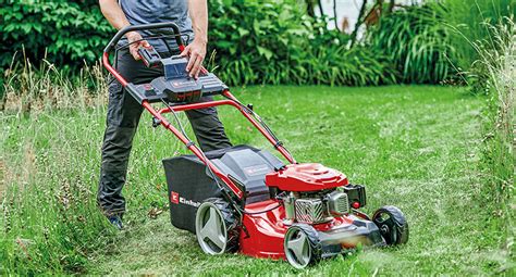 Thematic photo of a person mowing a lawn with a Einhell petrol lawnmower