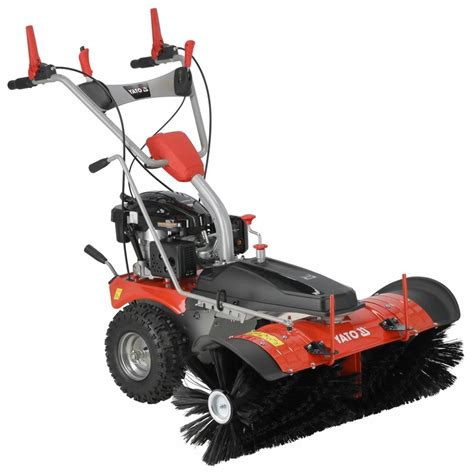 Zbliżenie na silnik zamiatarki z zaznaczonymi elementami do uruchamiania