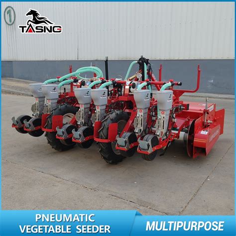 Thematic photo of a vegetable seeder machine in operation