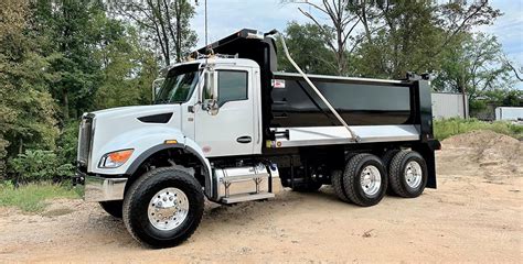 Thematic photo of a rental fleet of various dump trucks