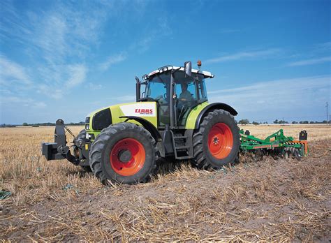 The Claas Ares 616 tractor in a field, illustrating its robust design and operational context.