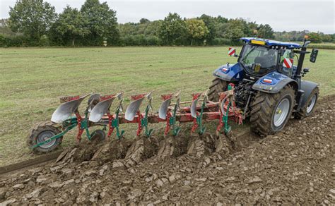 Photo of the tiller transformed into a micro-tractor with a plough attached