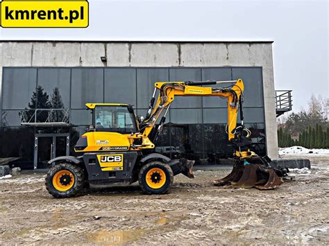 Koparka kołowa JCB HD110WT 4F Hydradig w akcji, prezentująca stabilność i widoczność.