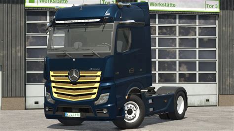 Zbliżenie na przedni pas ciągnika Mercedes-Benz Actros z charakterystycznymi reflektorami