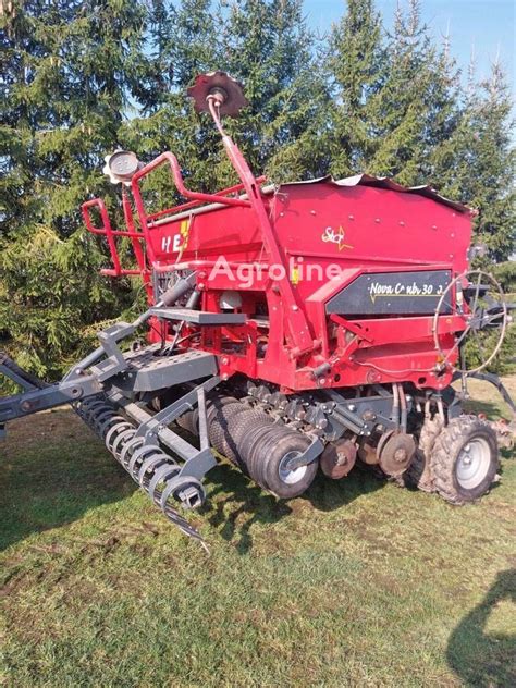 Photo of Tume Super Nova Combi seed drill with visible electric dosing system and large hopper