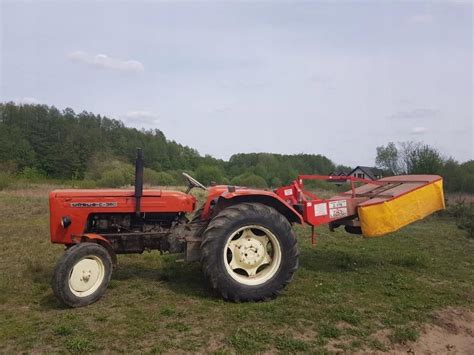ciągnik C-360 z kosiarką bijakową
