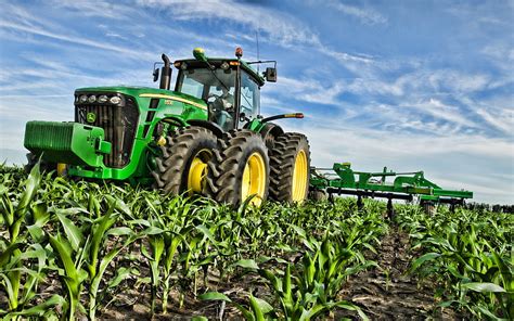 Thematic photo of a John Deere 8530 tractor working in a field