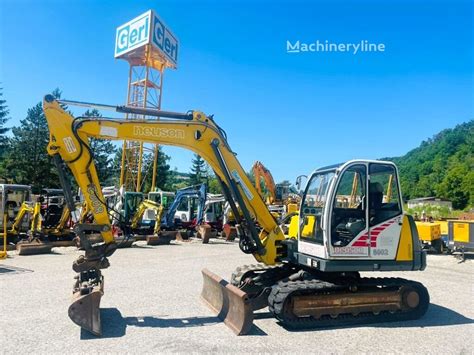 Thematic photo of a Neuson 303 RDV mini excavator at work