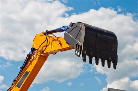 Thematic photo of an excavator bucket in a construction environment