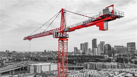 Historical photos of tower cranes used in the construction of iconic skyscrapers