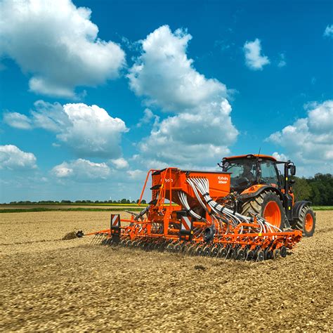 Thematic photo of various Kubota seeders in an agricultural field during operation