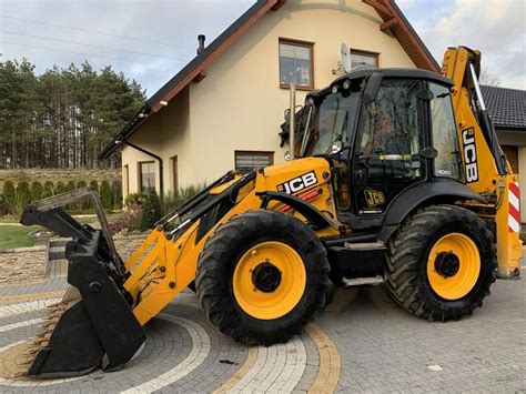 Zdjęcie koparko-ładowarki JCB 4CX z ruchomymi elementami