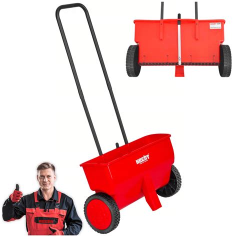 Siewnik Hecht 220 w ogrodzie, z wyraźnym mechanizmem rozsiewu