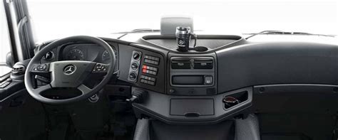 Interior of a Mercedes-Benz Atego cab, highlighting the dashboard and driver's seat