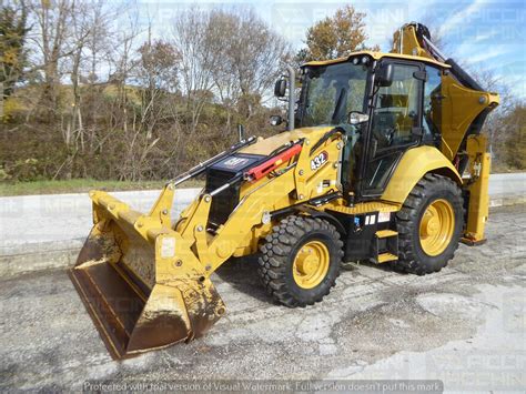 Thematic photo of a compact Caterpillar backhoe loader 428 or 432 working on a construction site