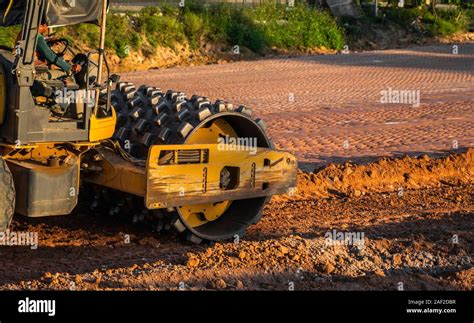 Thematic photo of a construction site with a trench compactor at work