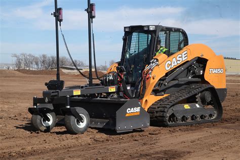 Photo of a compact tractor with a front-mounted grading attachment, suitable for landscaping and smaller jobs