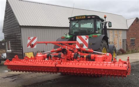 Thematic photo of a KUHN rotary harrow in operation on a field