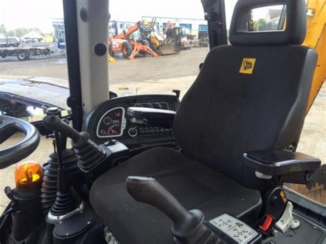 Interior of a JCB 3CX cabin, showing controls and operator's seat