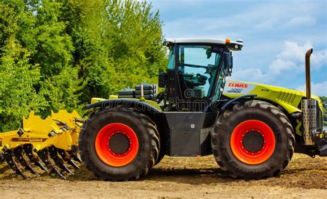 Thematic photo of a modern Claas tractor working in a field