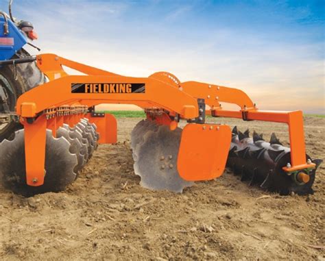 Thematic photo of a modern disc harrow working in a field at high speed