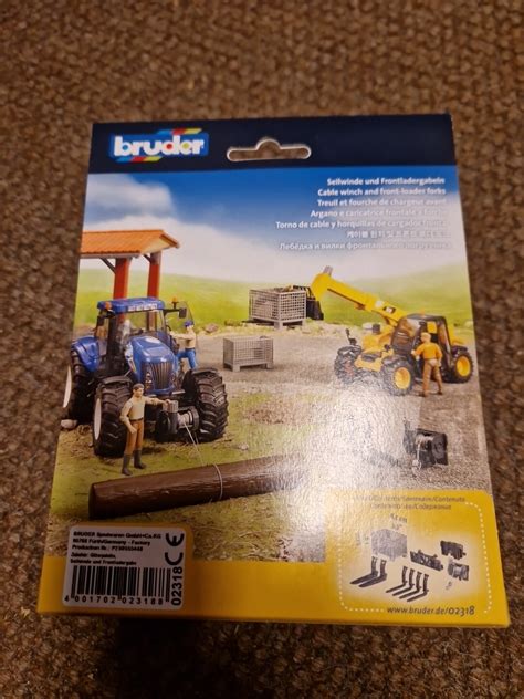 Photo illustrating Bruder accessories compatible with the tractor