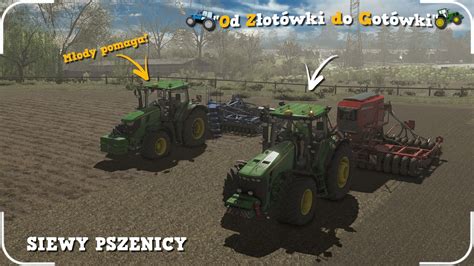 John Deere 8RX z szerokim siewnikiem DB60 na polu