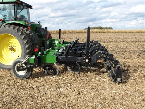 Photo of a homemade deep ripper with a double disc roller