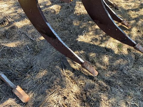 Close-up photo of the working elements of a homemade deep ripper (tines, cutting wings)