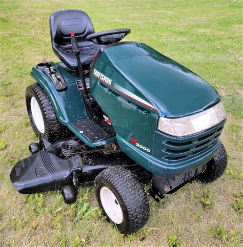 Thematic photo of a Craftsman ride-on mower on a large lawn