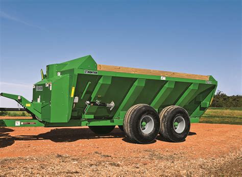 Table comparing manure spreader discharge systems